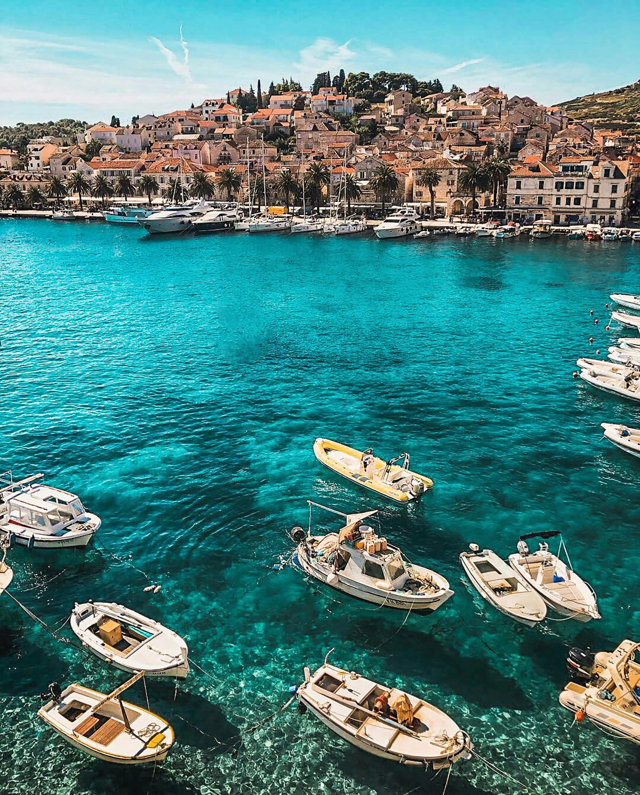 Service-2-min Boats in the vibrant blue waters of Hvar, Croatia, showcasing a charming coastal town under sunny skies.